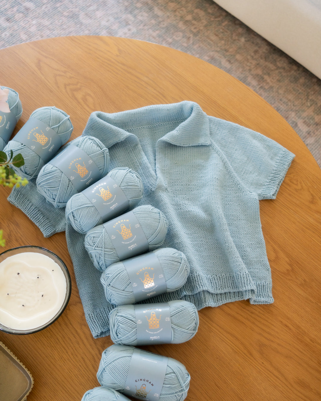 light blue yarn and sweater knitting pattern
