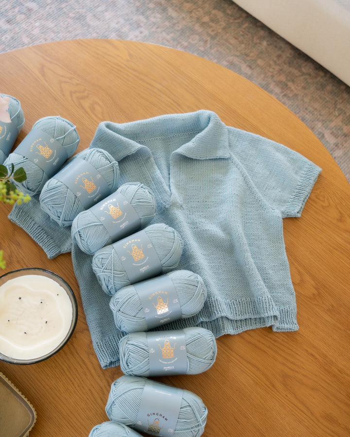 light blue yarn and sweater knitting pattern